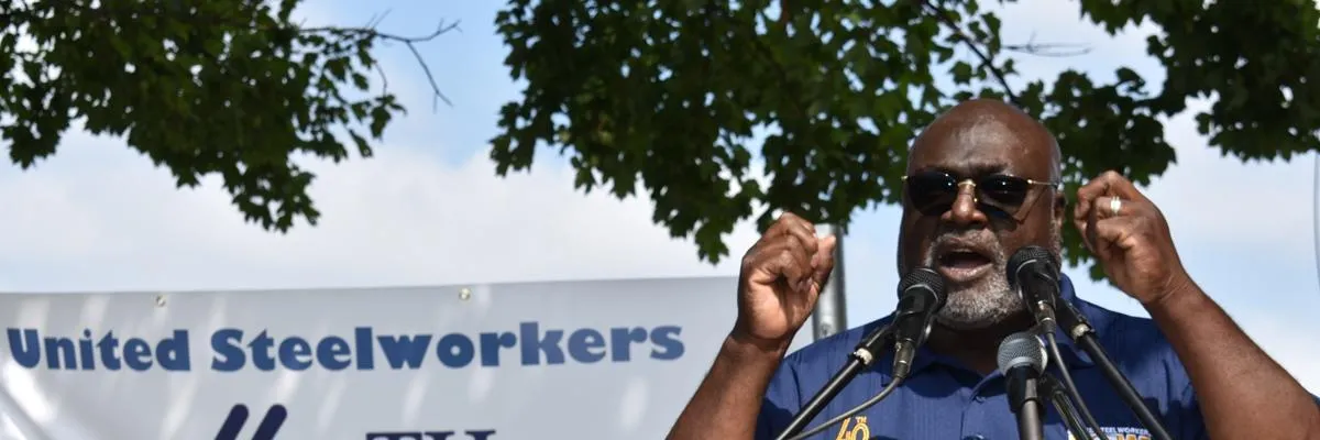 USW Local 8888 President speaking at a podium